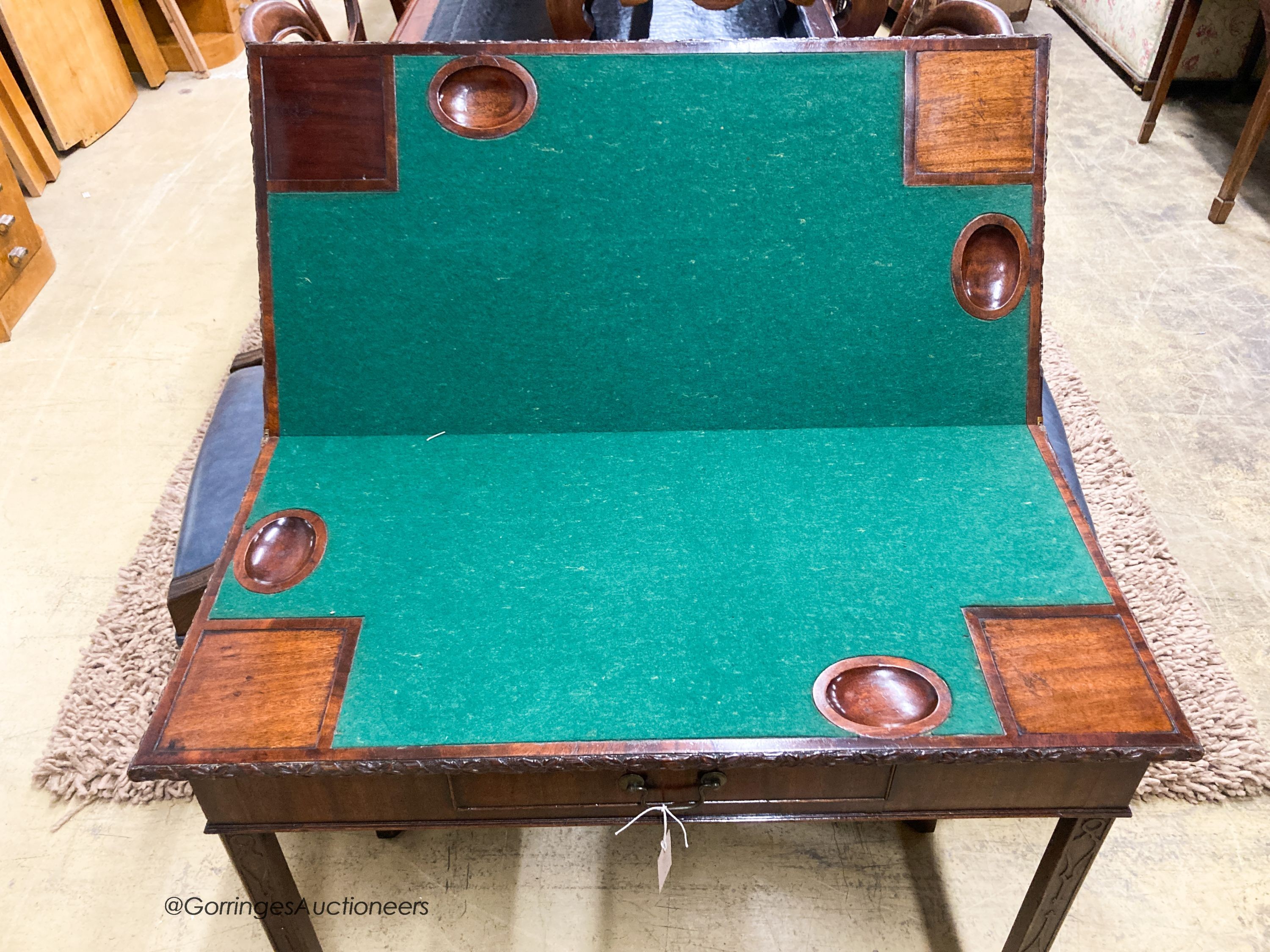 A George III rectangular mahogany concertina card table, W.93cm D.46cm H.76cm